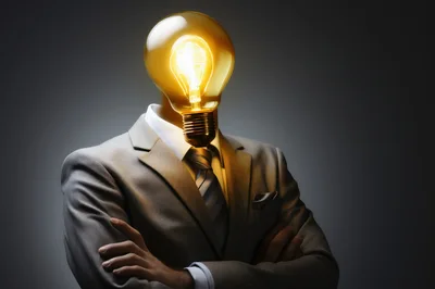 Businessman With A Glowing Lightbulb Head