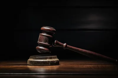 Wooden Judge Gavel Resting On A Sounding Block
