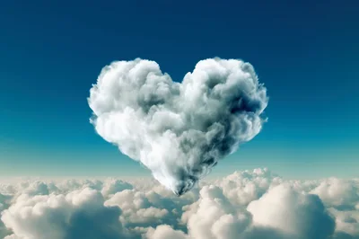 Heart Shaped Cloud Floating Above A Sea Of Clouds