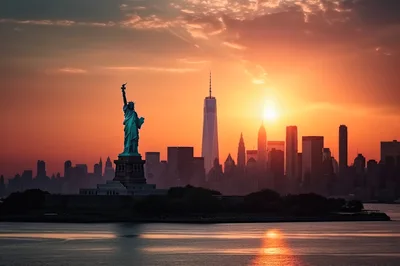 Statue Of Liberty And New York City Skyline Sunset