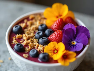 Acai Smoothie Bowl Topped With Fresh Berries And Flowers