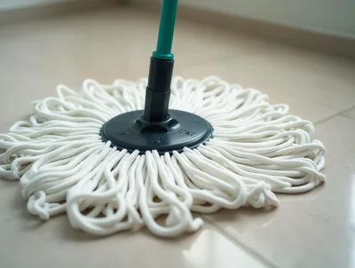 White String Mop Head On Tiled Floor