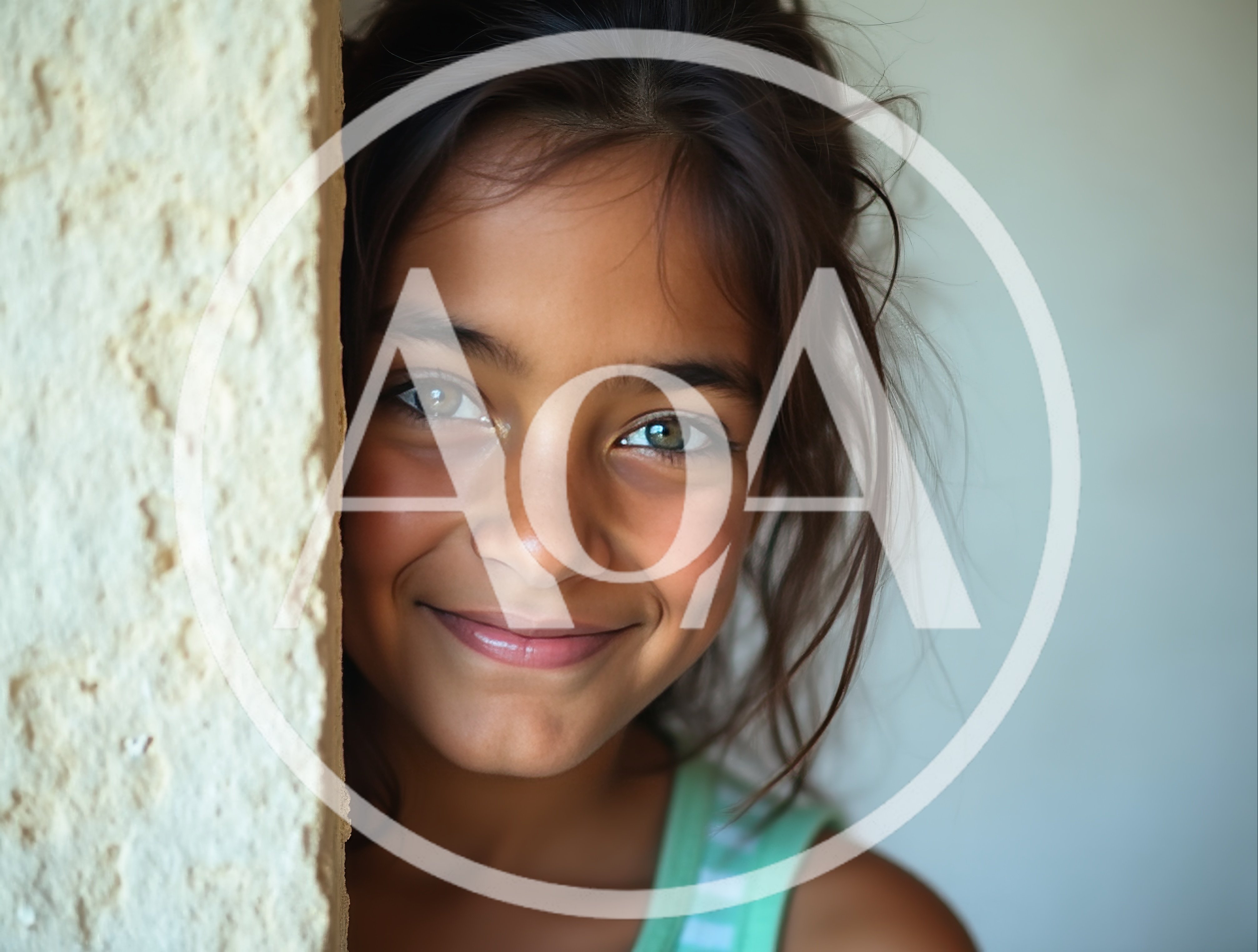 Portrait Of A Smiling Young Girl With Green Eyes