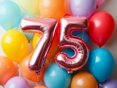 Rose Gold Number 75 Balloons Against Colorful Background
