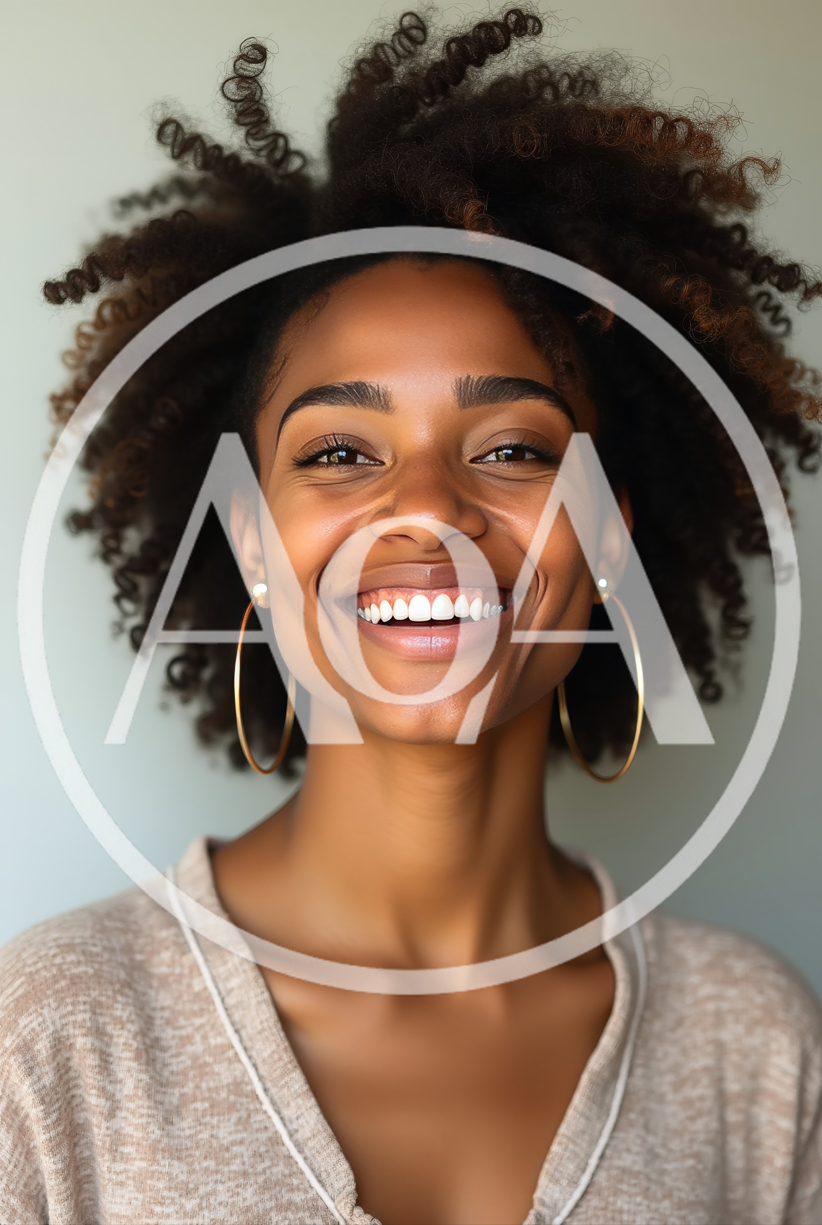 Portrait Of A Smiling Young Woman With Curly Hair