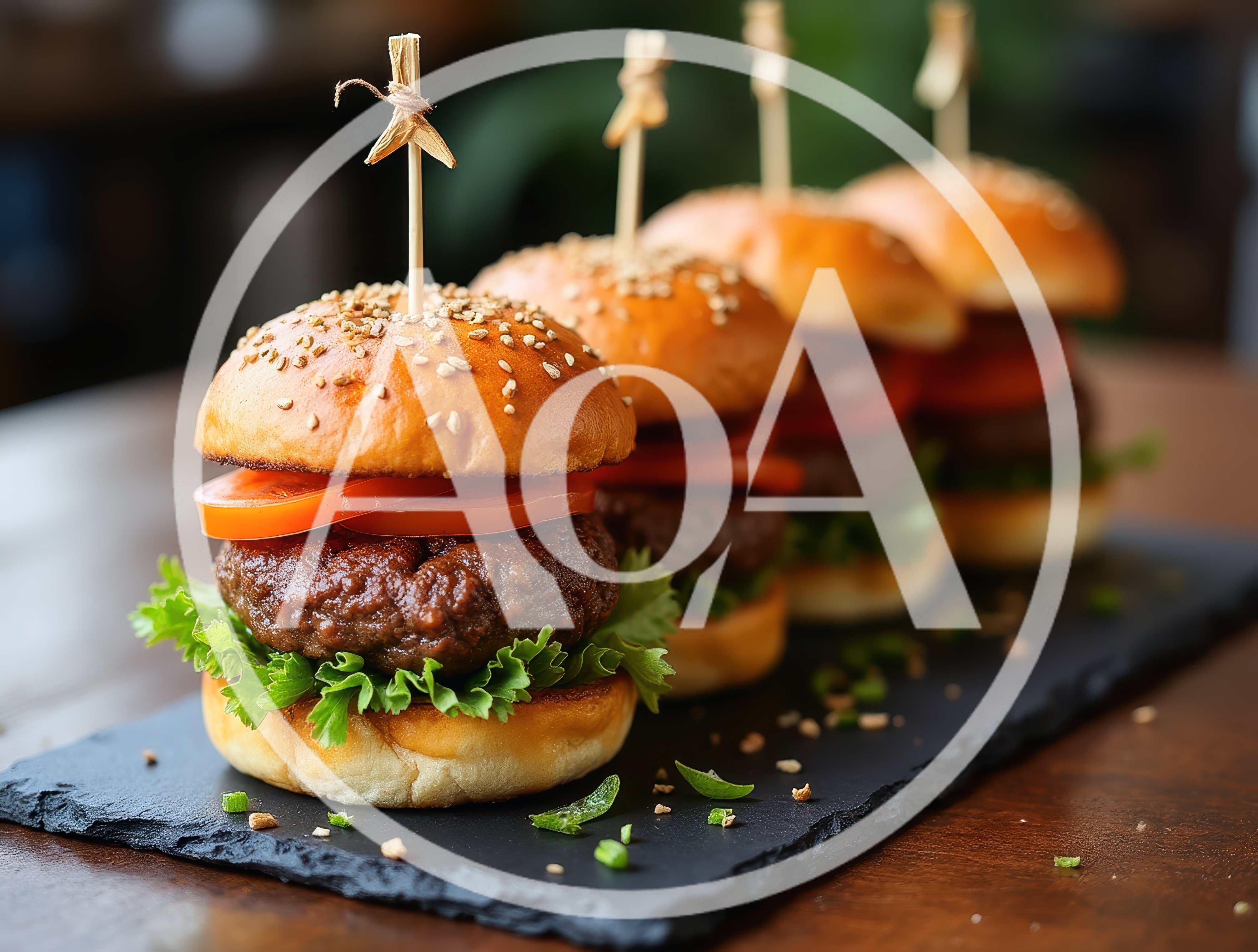 Four Gourmet Beef Sliders on a Slate Serving Board