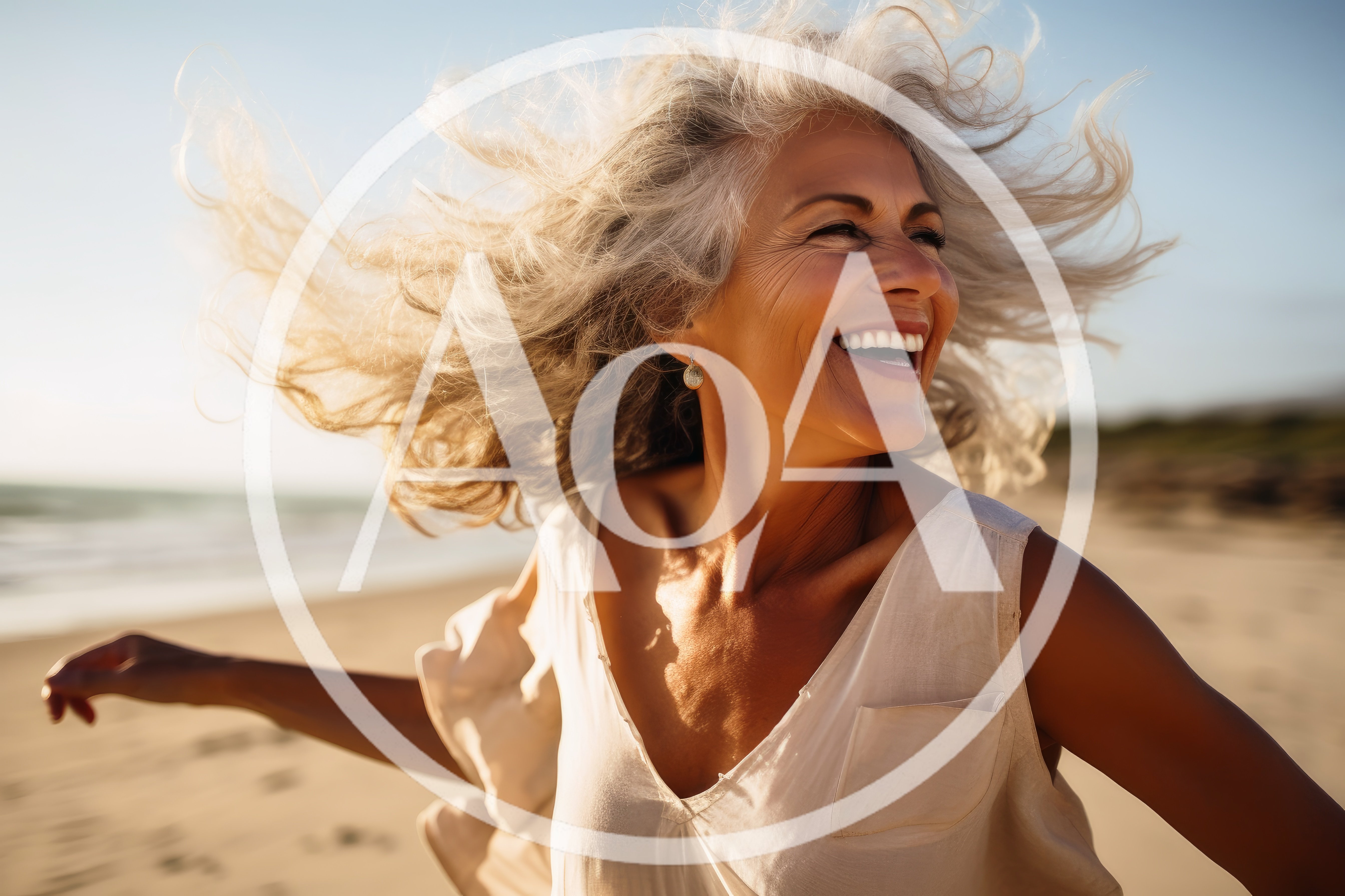 Happy Mature Woman With Flowing Hair On Beach