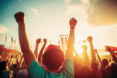Crowd Celebrating At An Outdoor Music Festival