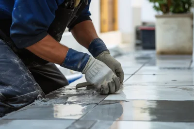 Construction Worker Installing Ceramic Floor Tiles