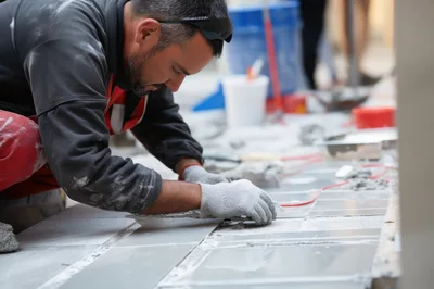 Professional Tiler Installing Ceramic Floor Tiles