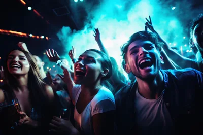Young People Dancing and Celebrating at Nightclub