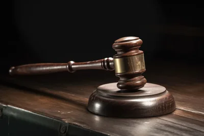 Wooden Judge Gavel Resting On A Sounding Block