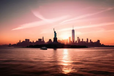 Statue Of Liberty And New York City Skyline Sunset