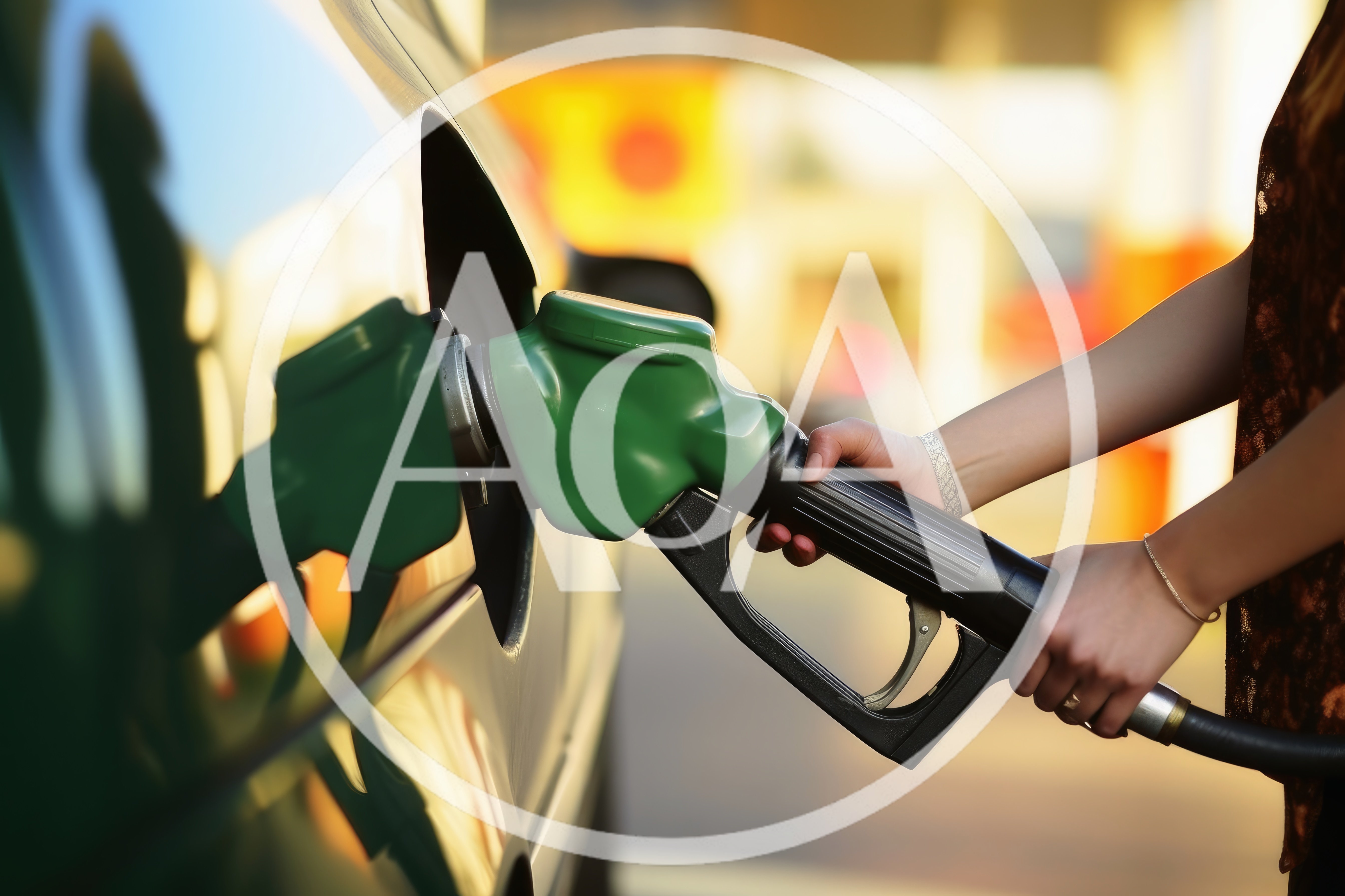 Woman Refueling A Car At A Gas Station
