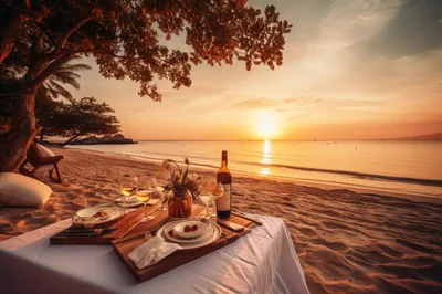 Romantic Beachside Dinner Setup At Sunset