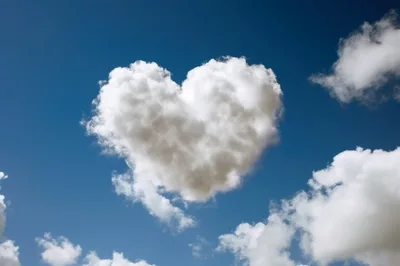 Heart Shaped Cloud Floating In A Clear Blue Sky