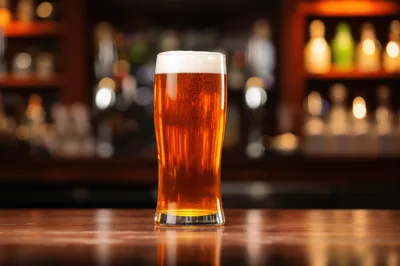 Pint Of Golden Beer On A Pub Bar Counter