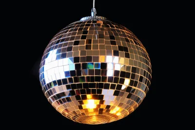 Reflective Disco Ball Hanging Against Black Background