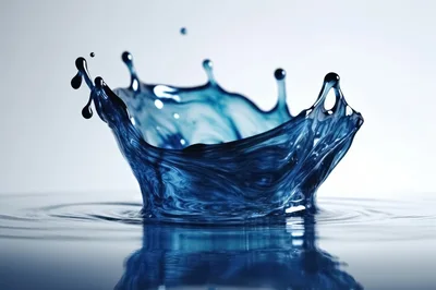 Blue Liquid Crown Splash On Reflective Surface