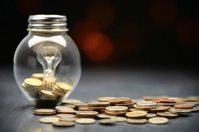 Light Bulb Jar Filled With Gold Coins