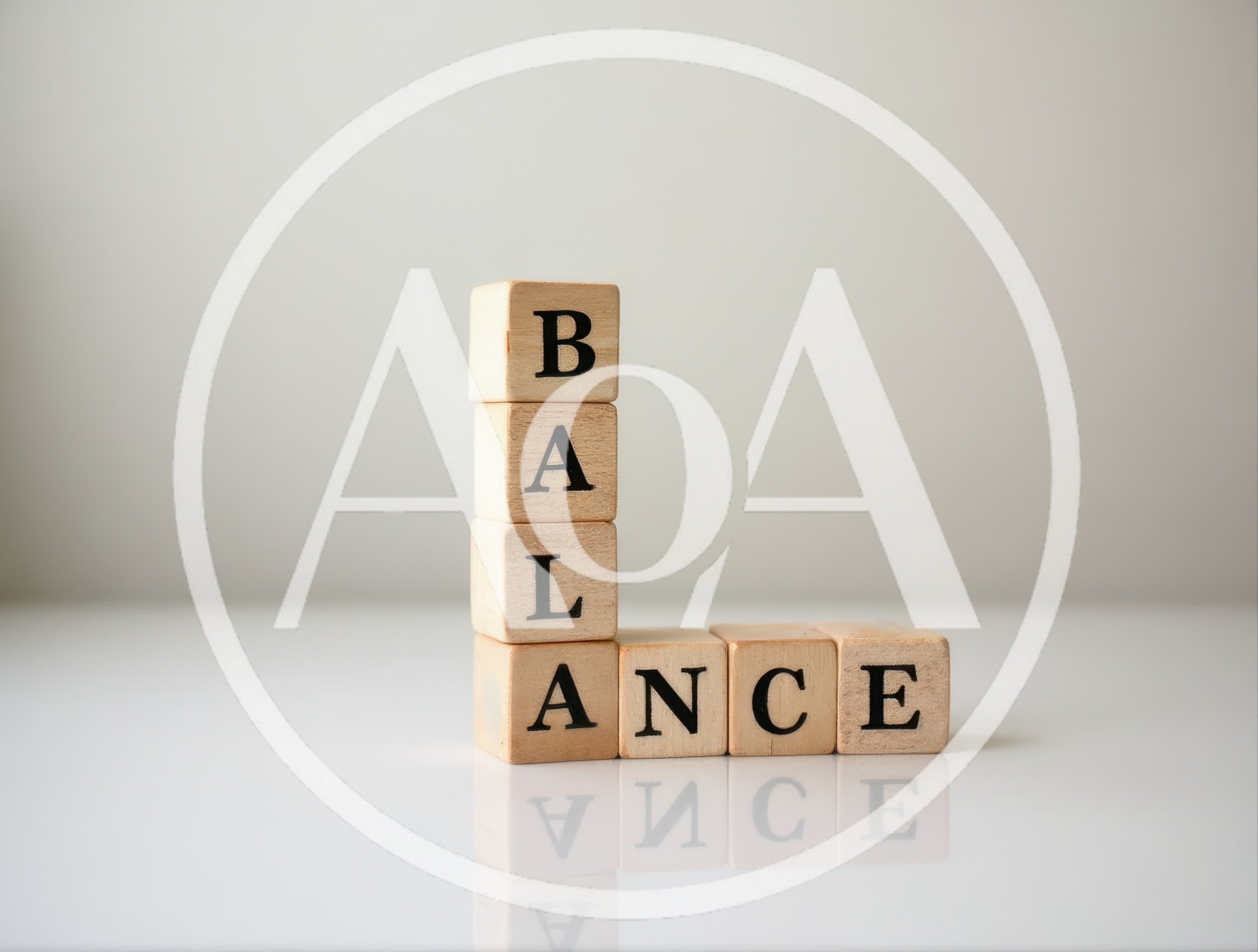 Wooden Blocks Spelling Balance On A Reflective Surface
