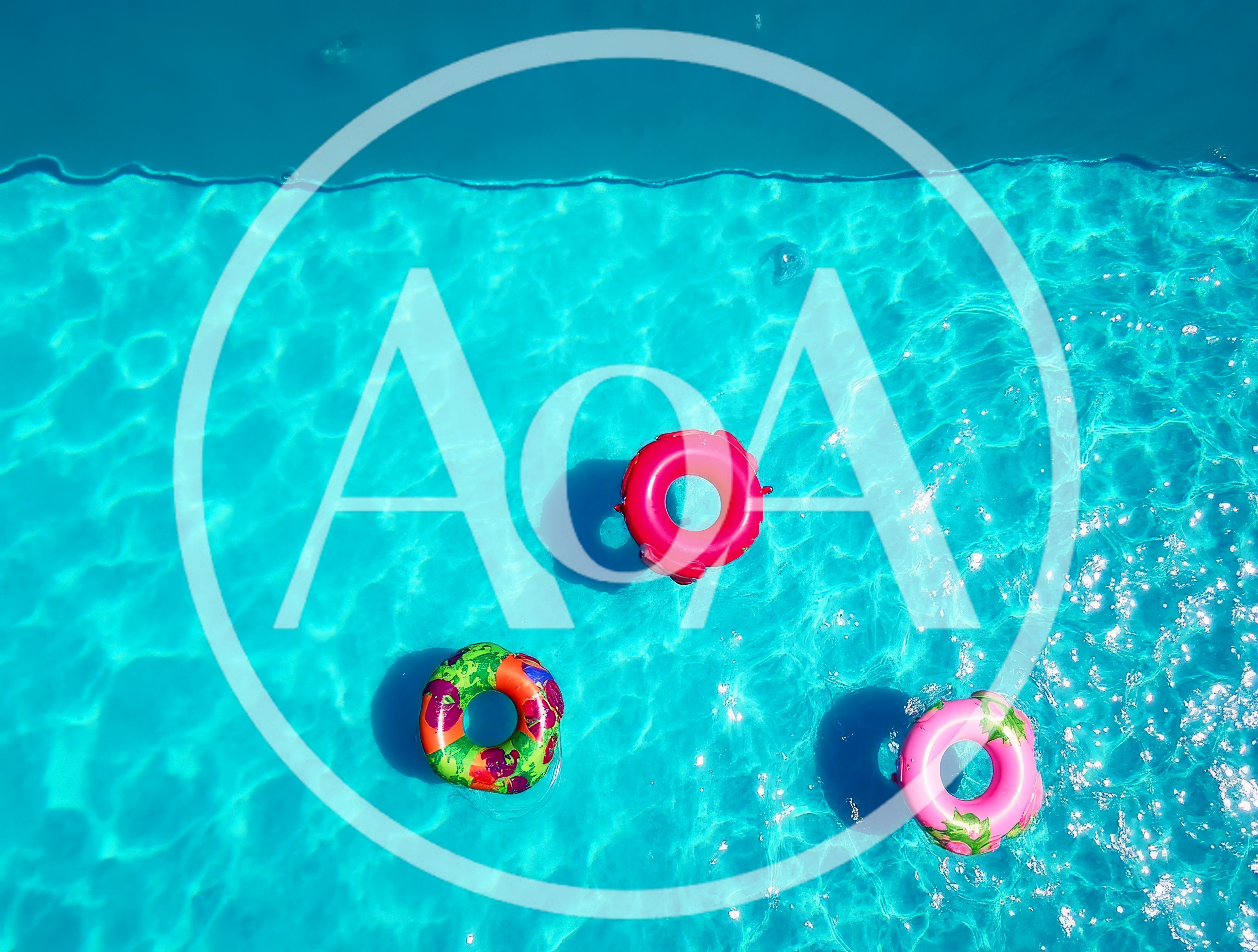 Three Colorful Inflatable Pool Floats In Swimming Pool