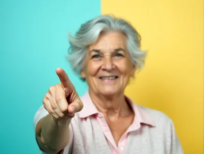Senior Woman Pointing Directly At Camera
