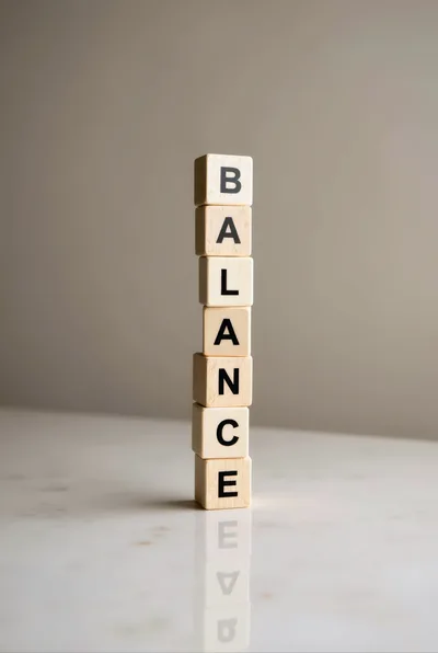 Wooden Blocks Stacked Vertically Spelling The Word Balance