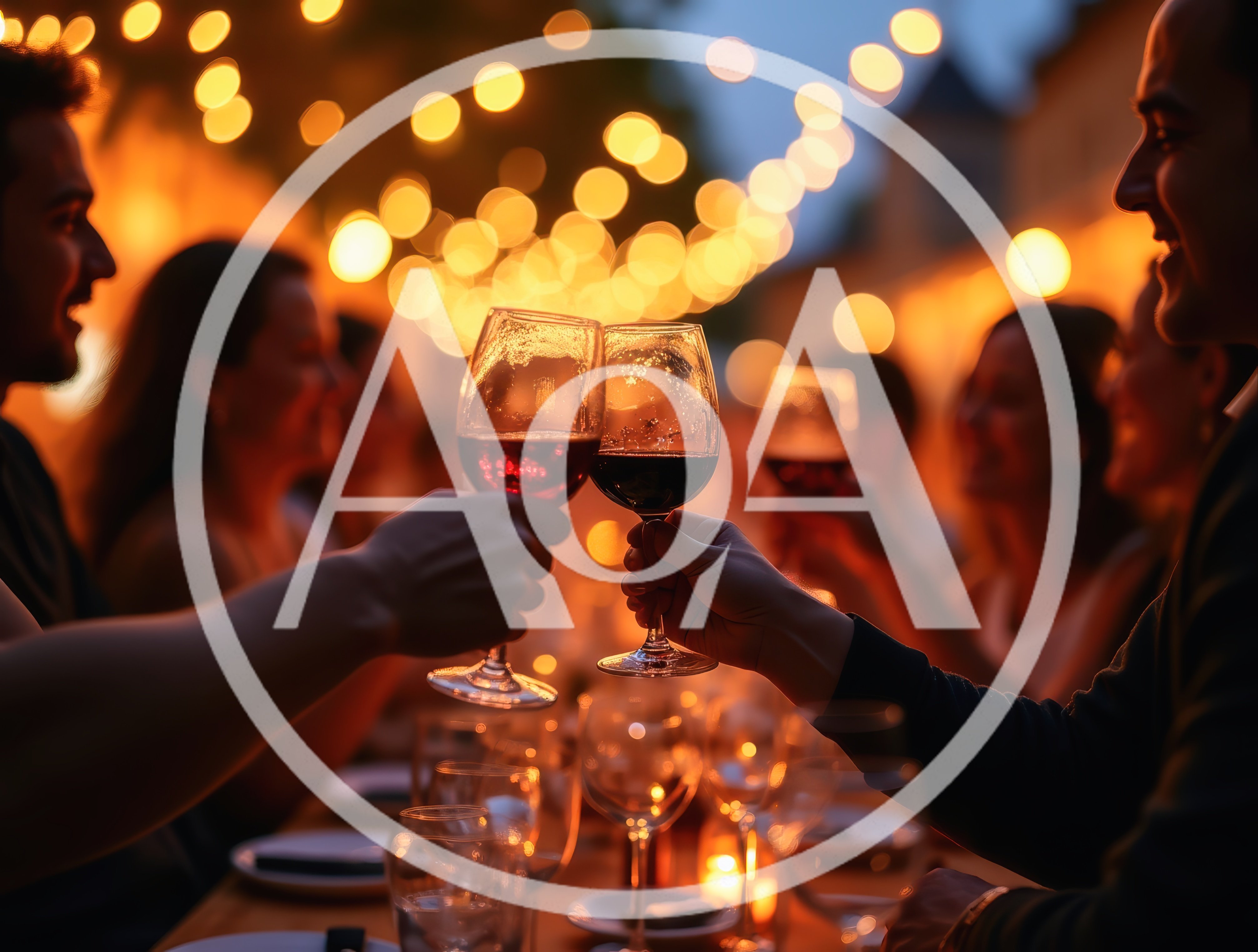 Friends Toasting With Red Wine At Outdoor Dinner Party