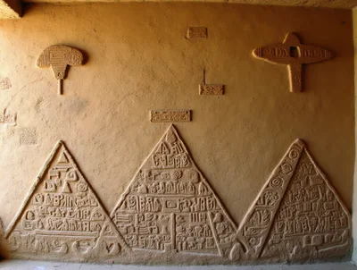 Ancient Egyptian Style Relief Carvings On Textured Wall