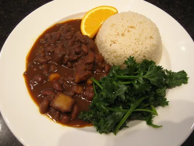 Plate Of Brazilian Feijoada With Rice And Greens