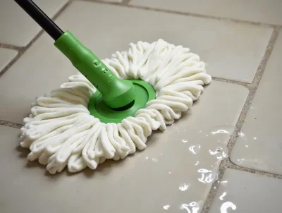 Green Mop Cleaning Wet Tile Floor