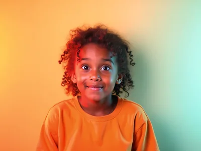 Portrait Of A Young Girl With Curly Hair