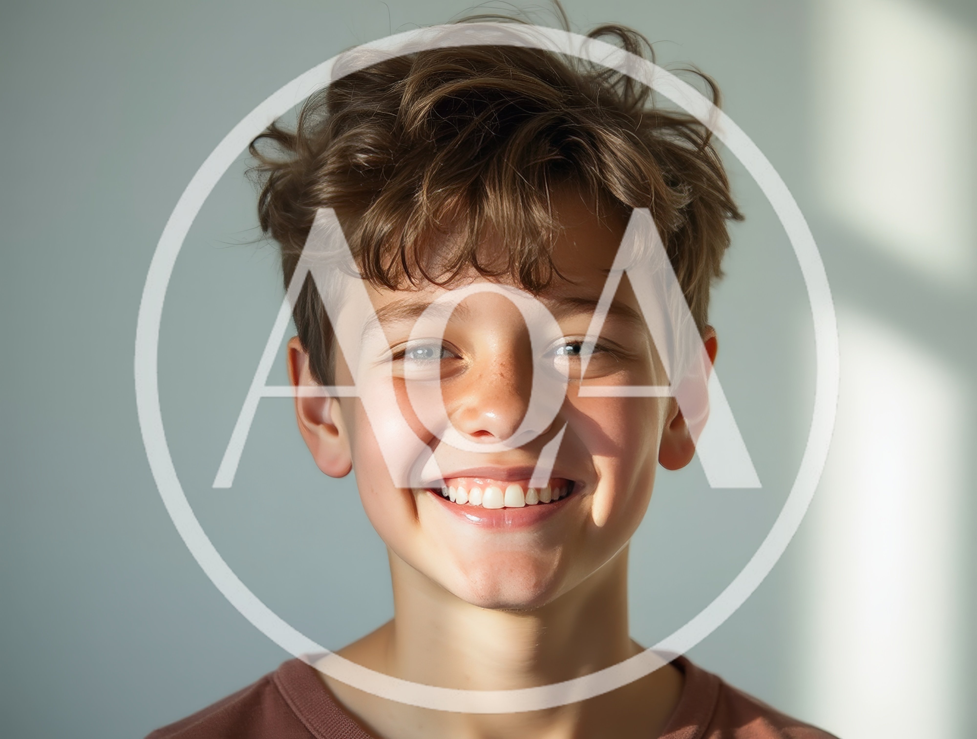 Portrait Of A Smiling Young Boy With Messy Hair