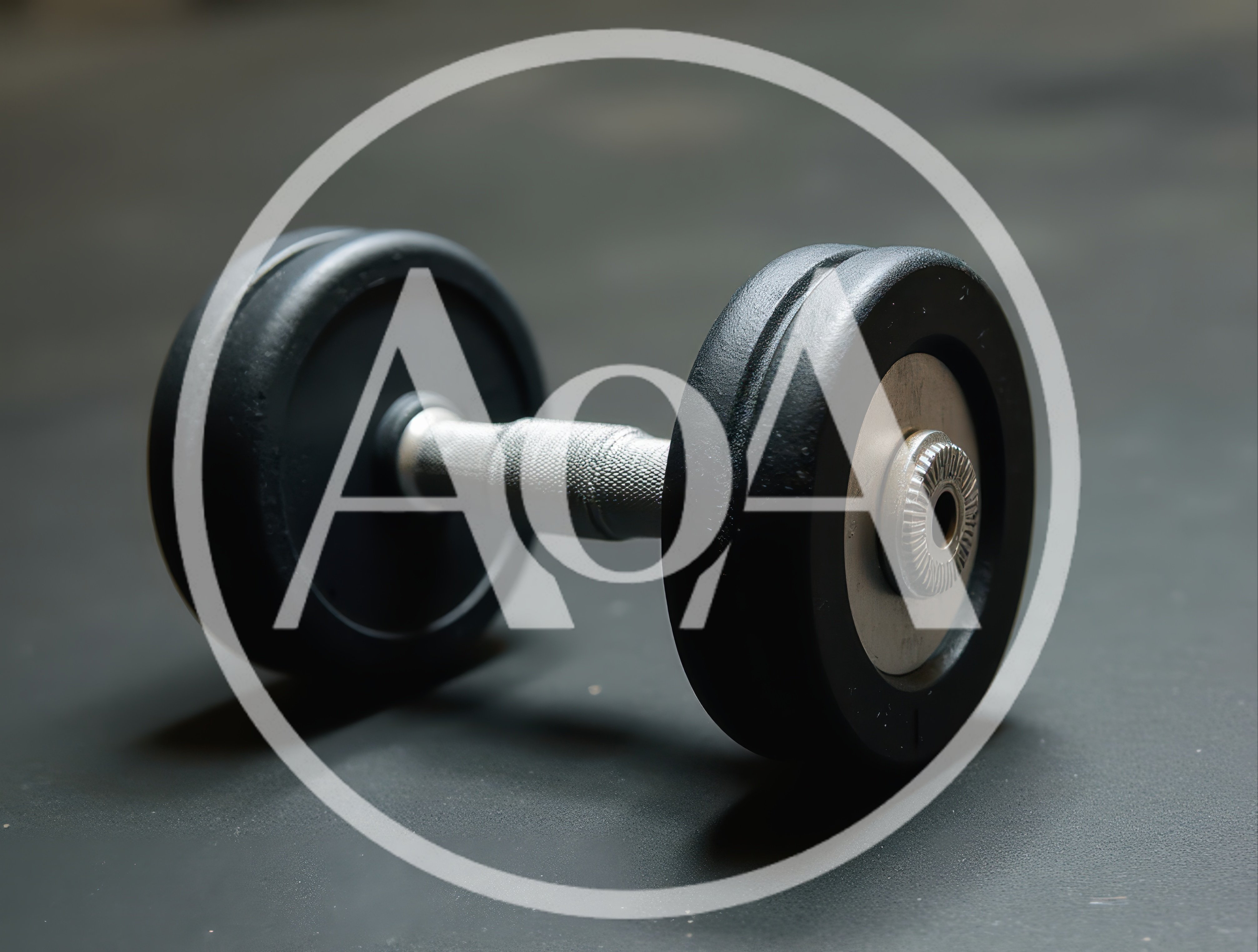 Single Black Rubber Dumbbell Resting On Gym Floor