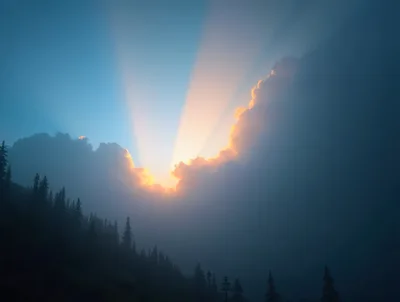 Sunlight Breaking Through Clouds Over Misty Forest