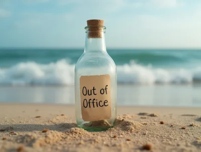 Glass Bottle With Out Of Office Note On Beach