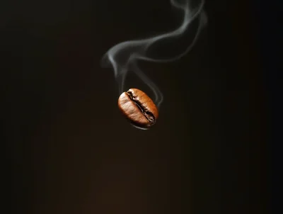Single Roasted Coffee Bean With Rising Steam