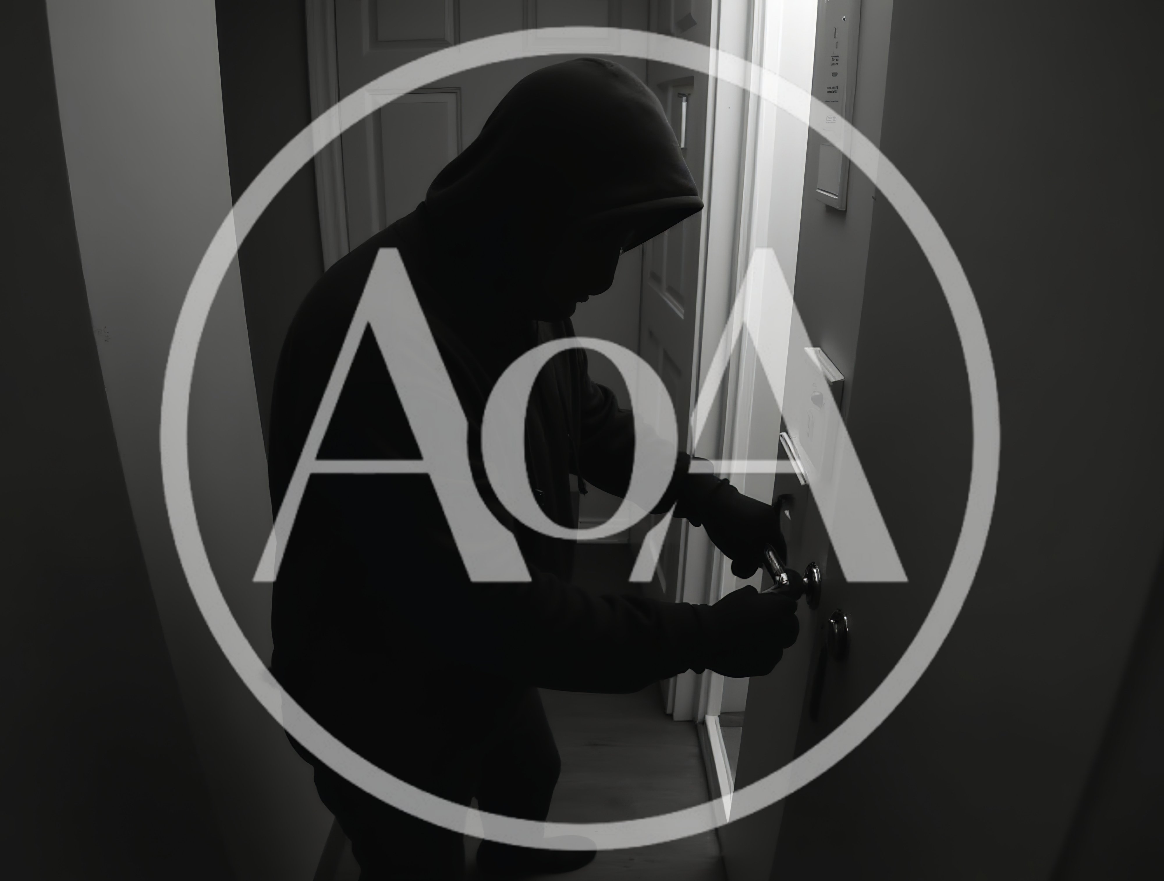 Intruder Wearing Hoodie Picking A Door Lock