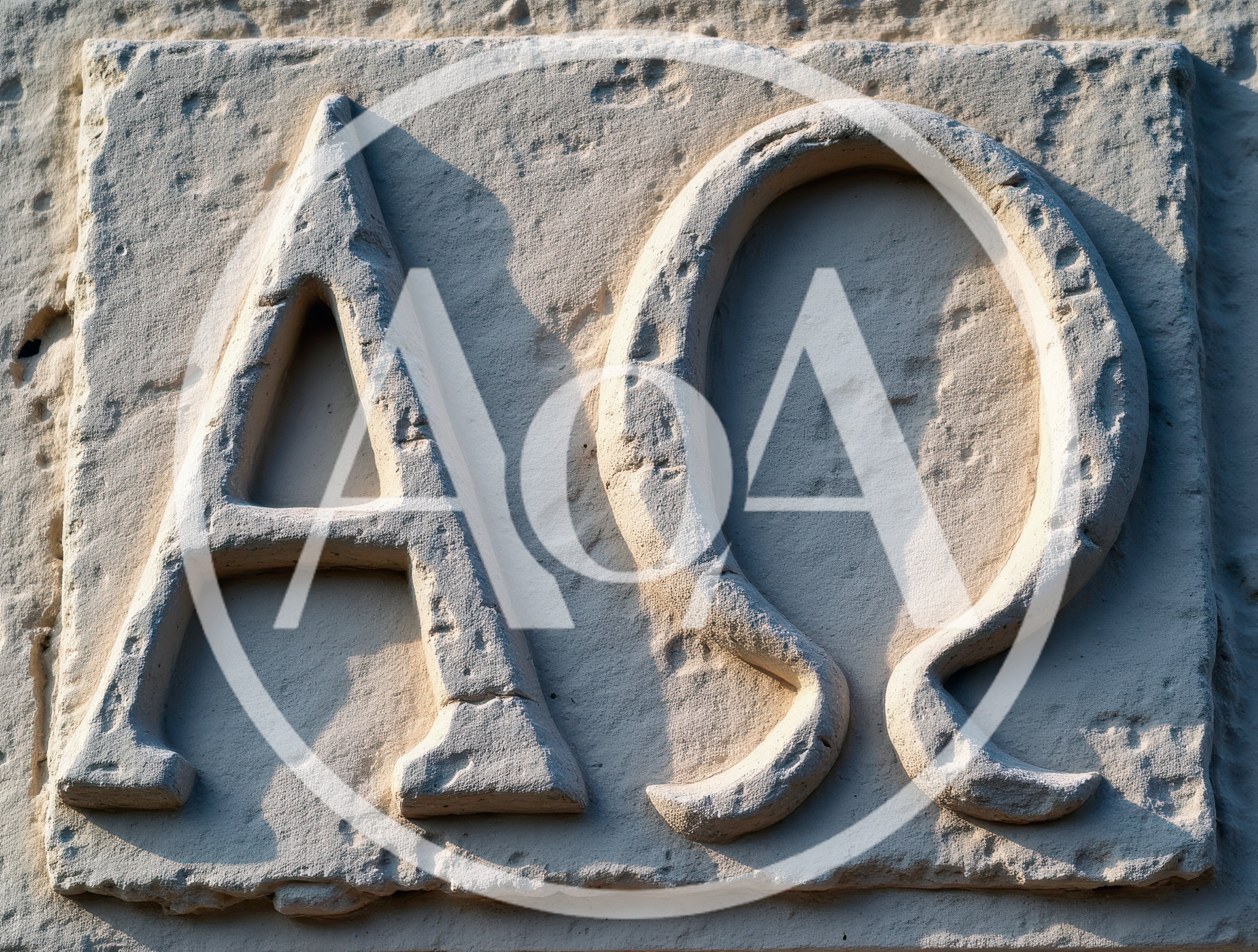 Stone Carving Of Alpha And Omega Symbols