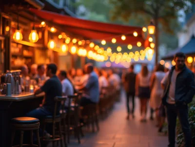 People Socializing At An Outdoor Bar At Night