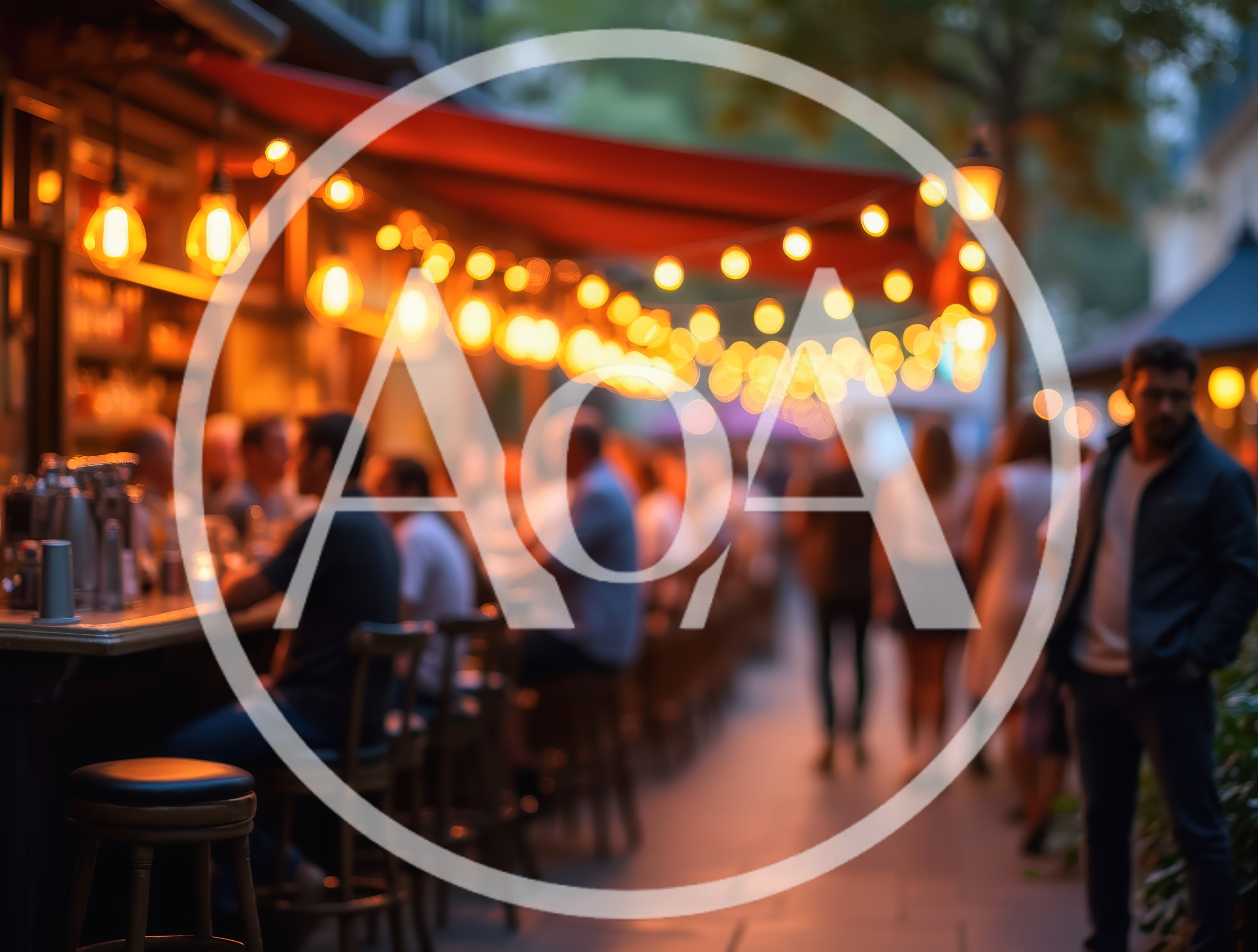 People Socializing At An Outdoor Bar At Night
