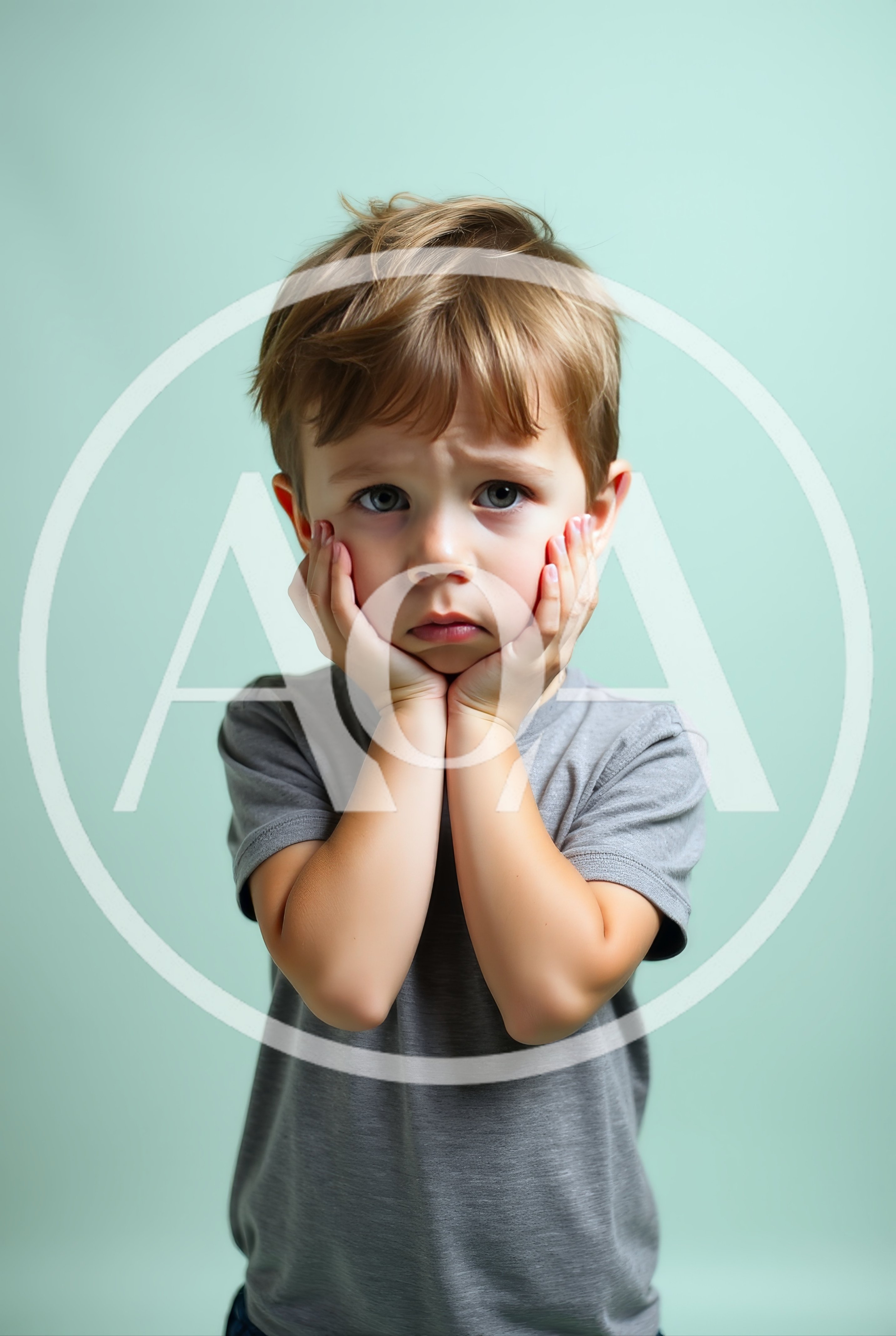 Sad Young Boy Holding His Face