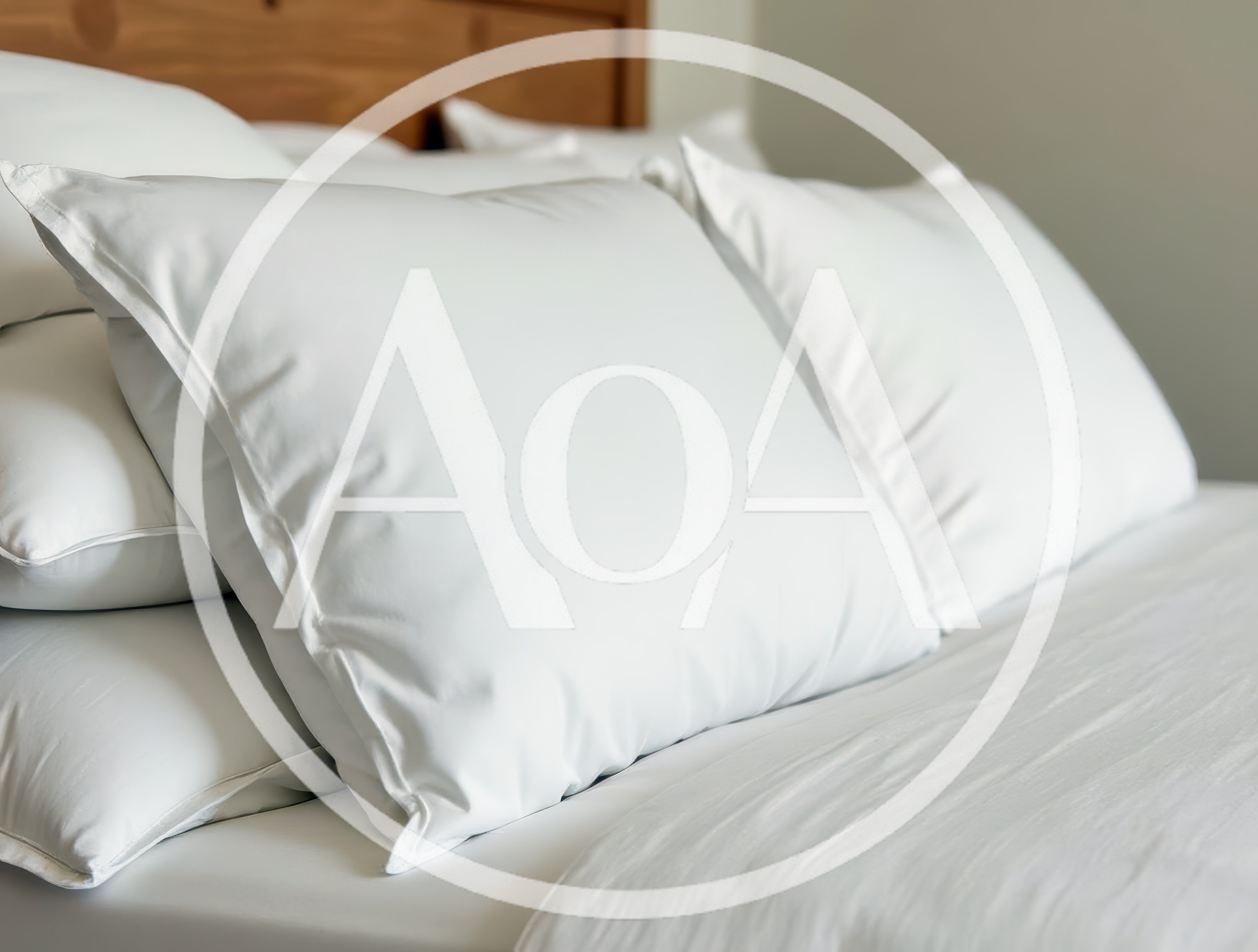 White Bed Pillows On A Made Bed