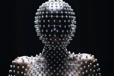 Person Wearing Futuristic Silver Beaded Face Mask