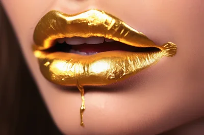 Close Up Of Lips With Metallic Gold Lipstick