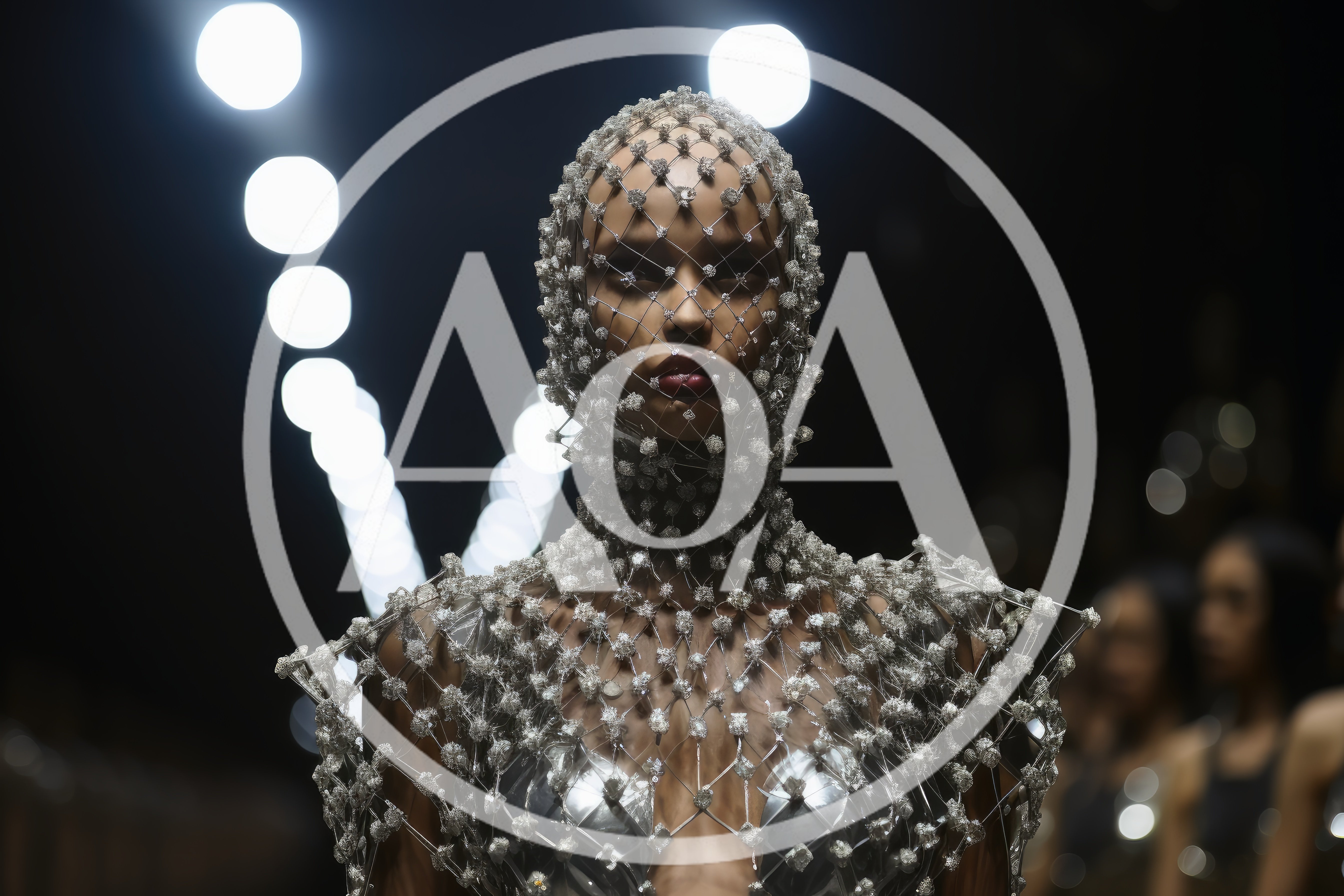 Model Wearing Intricate Beaded Headpiece On Fashion Runway