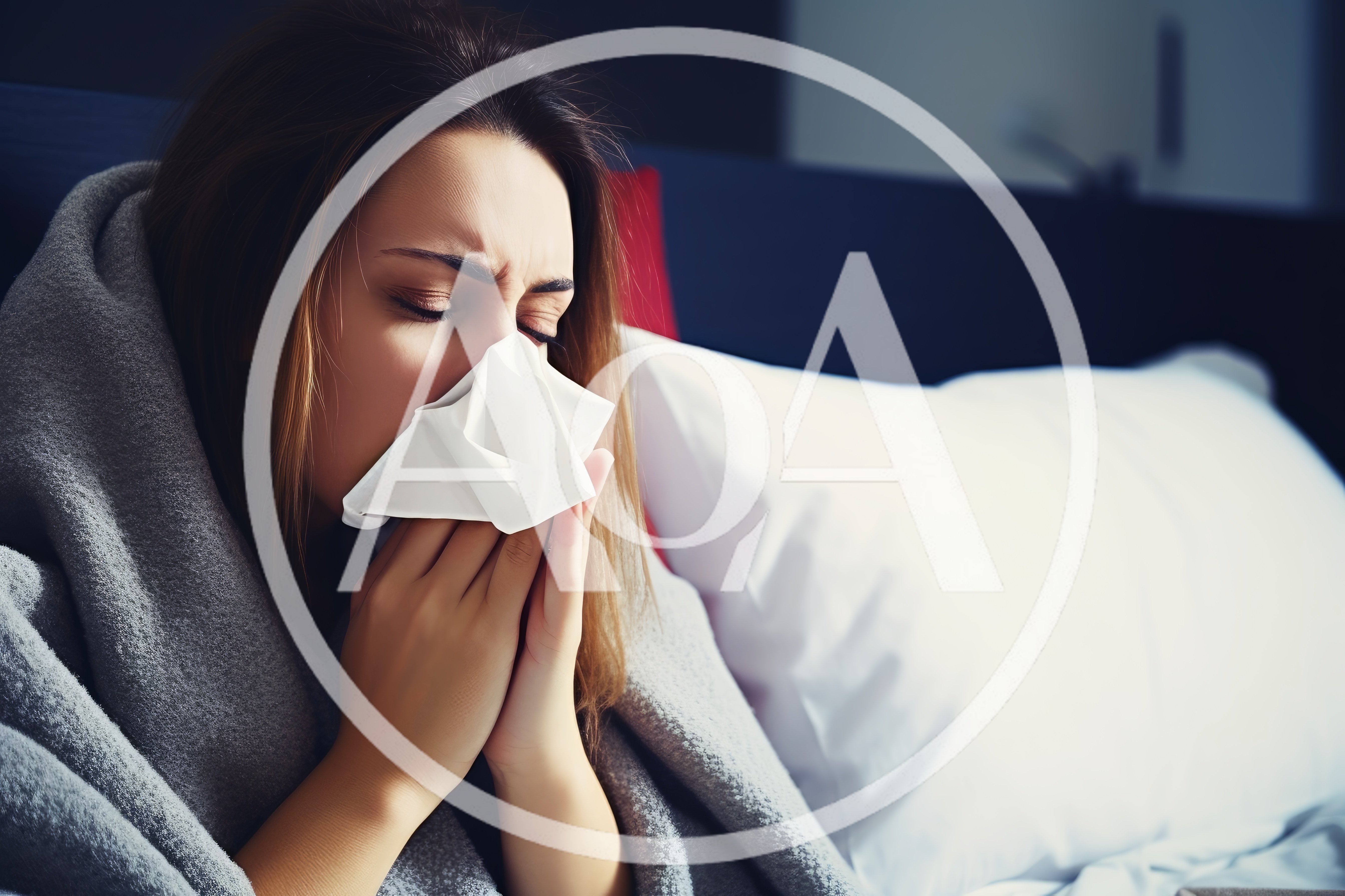 Sick Woman Blowing Her Nose In Bed