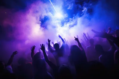 Crowd Dancing at a Nightclub with Laser Lights