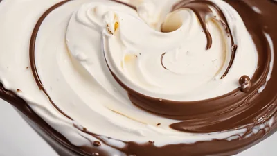 Swirling Chocolate And Cream Filling In A Bowl